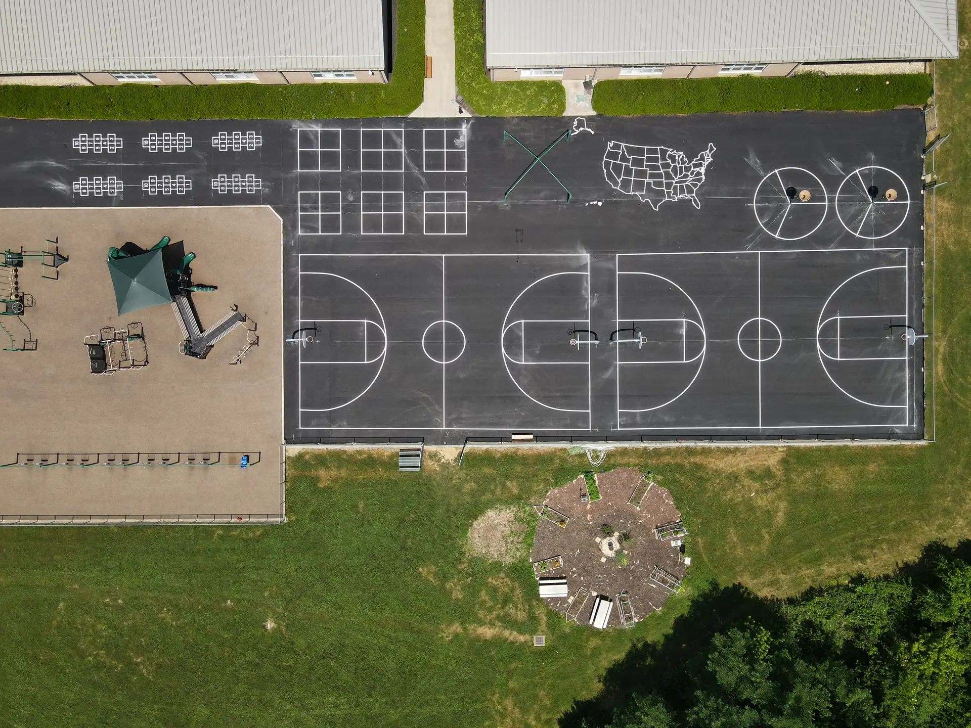 Aerial view of sports courts and playground.