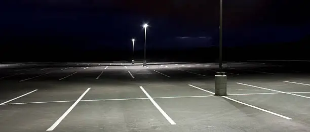 Empty parking lot at night
